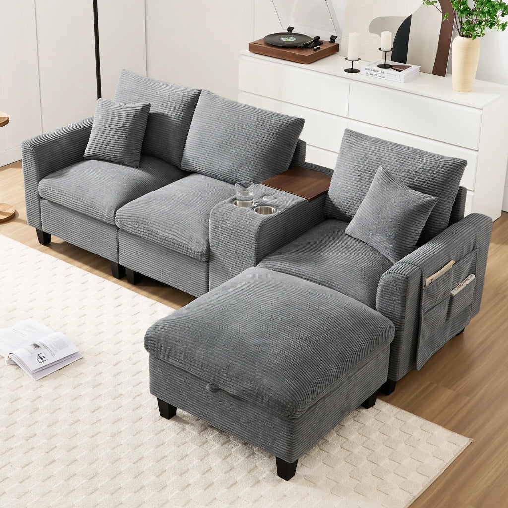 Divano angolare modulare in corduroy con consolle centrale porte USB portabicchieri e cuscini grigio per soggiorno
