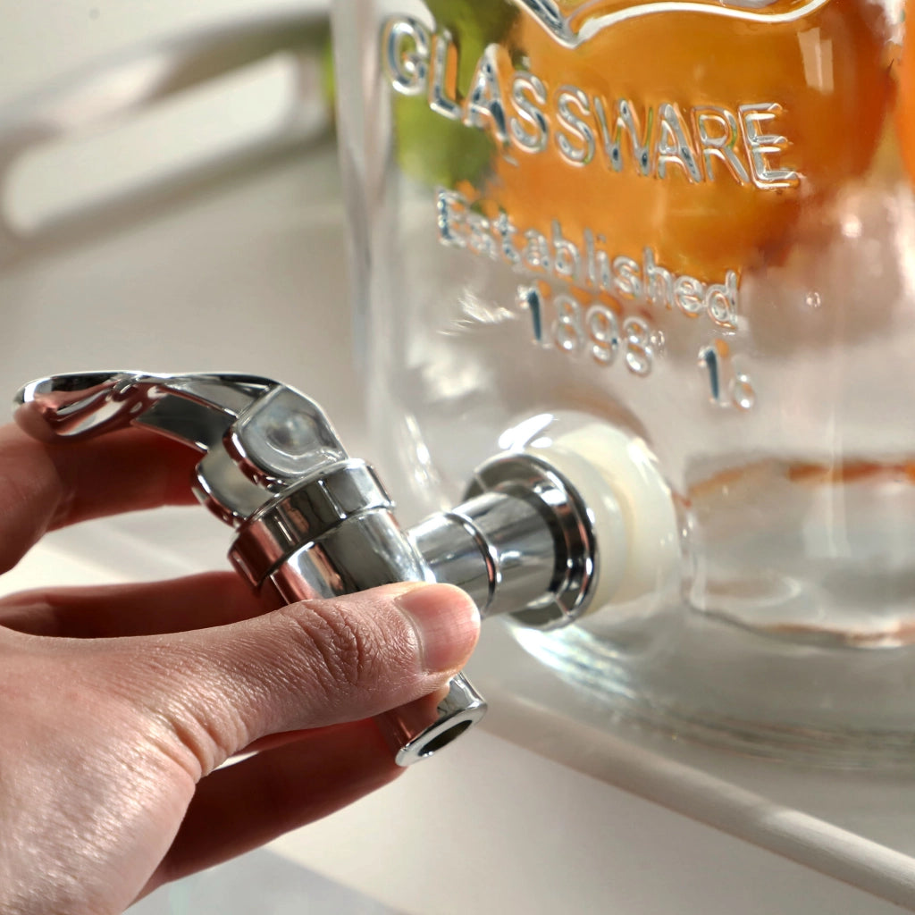 Barattolo KADAX con rubinetto da 4 litri in vetro con inserto per bevande come acqua, limonata e succo di frutta.