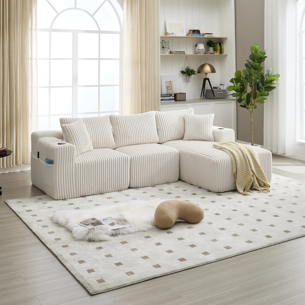 Divano modulare beige con penisola, velluto a coste, 5 cuscini e portabevande laterali