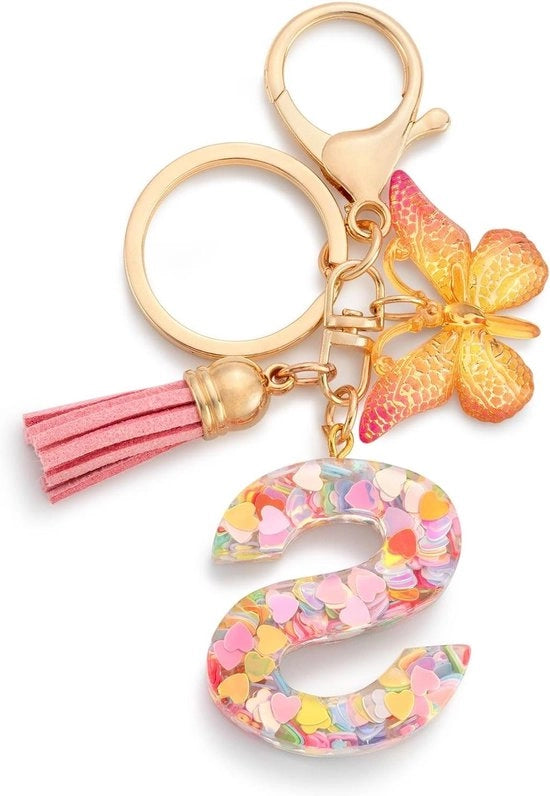 Sostegno per le chiavi per bambine con lettera S e disegno farfalla in colore rosa
