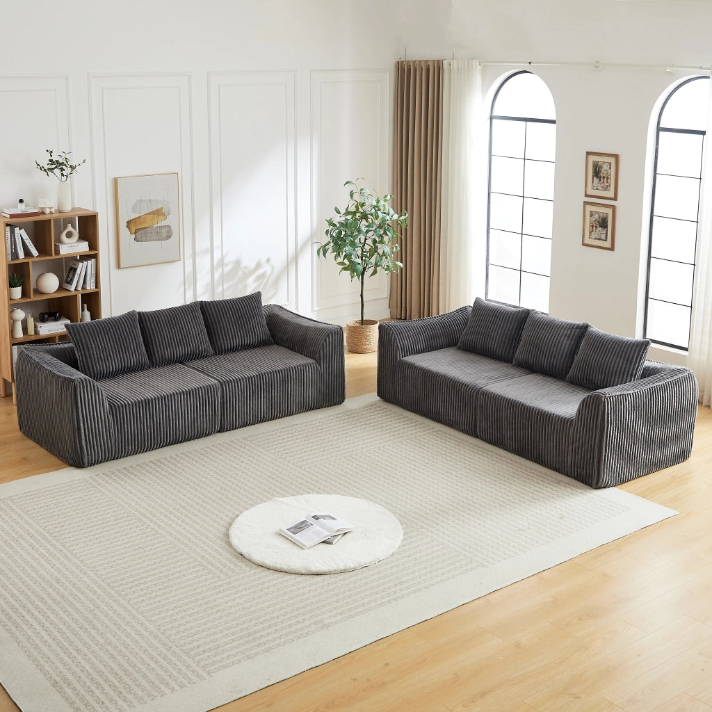Divano modulare in velluto a coste con linee sinuose e seduta ampia, per soggiorno e relax quotidiano, grigio