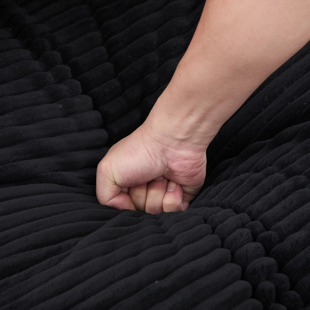 Poltrona letto 2 in 1 in corduroy nero, seduta extra profonda con schienale alto, doppi portabevande e tasche laterali