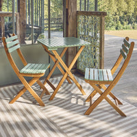 Tavolo da giardino in legno di acacia, 2 sedie pieghevoli, verde