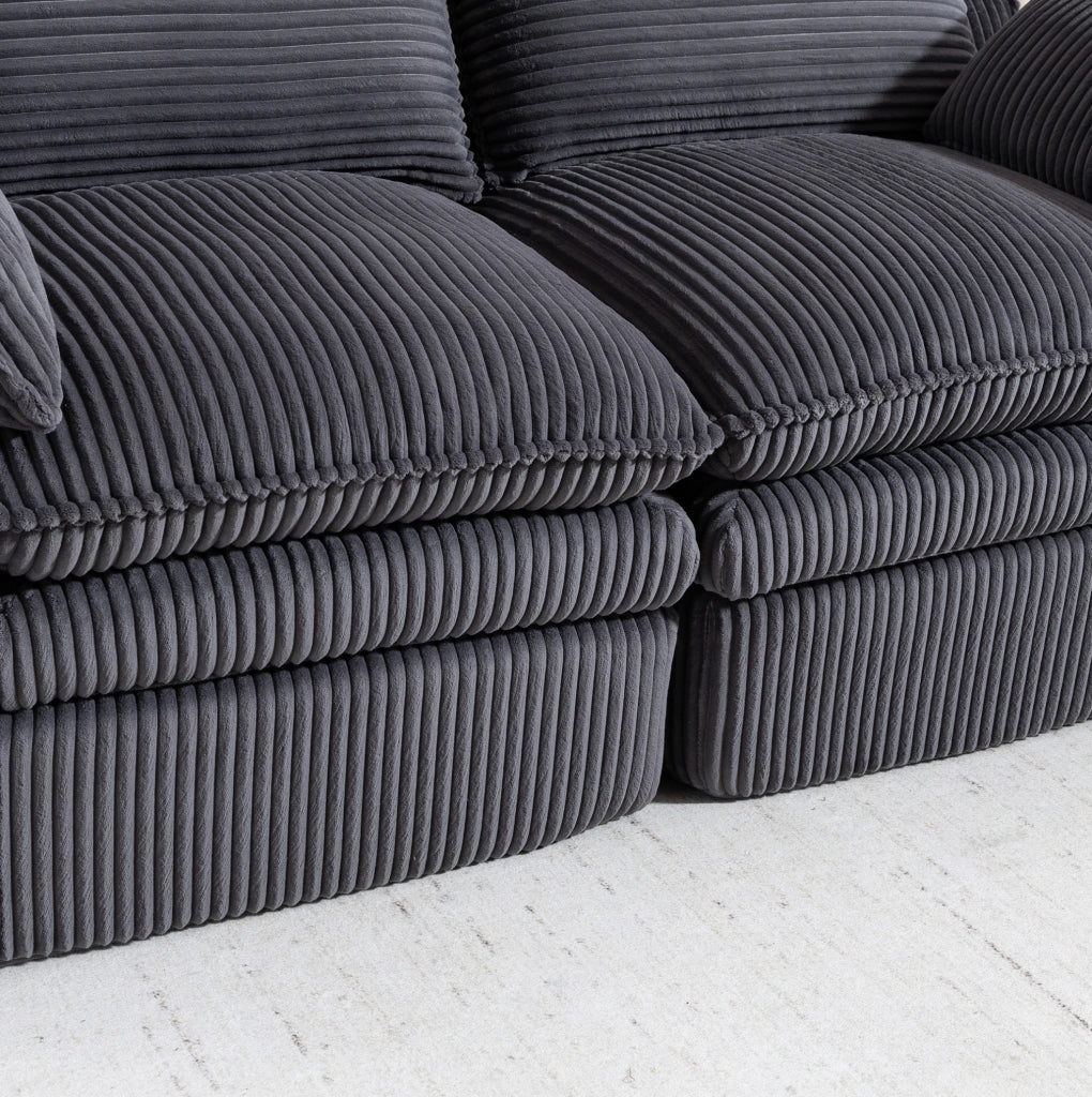 Divano 2 posti ULEVR 191x94x85 cm in velluto a coste grigio scuro con tasche laterali e cuscini