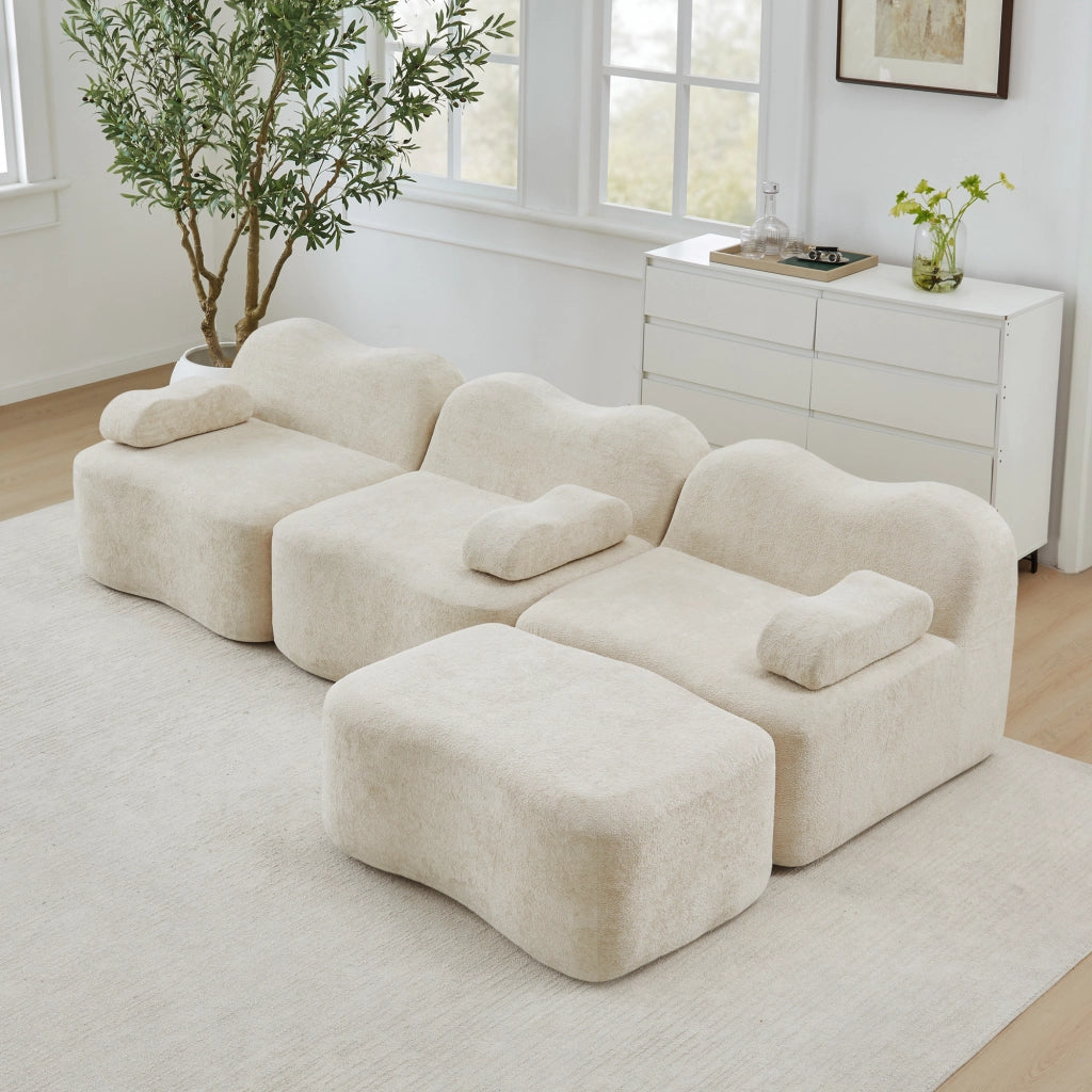 Divano angolare modulare senza struttura con seduta profonda e pouf collegabile in velluto beige per soggiorno