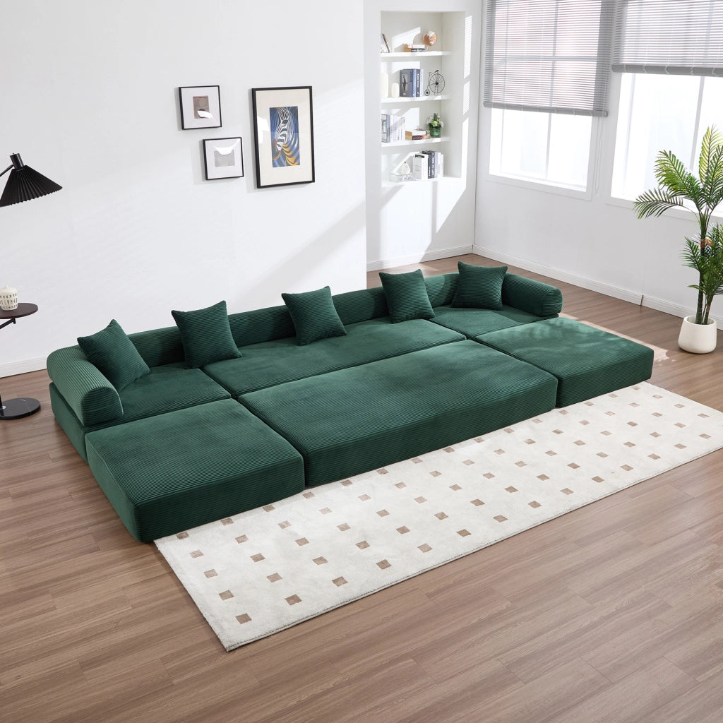 Divano modulare 270x180x64 cm trasformabile in letto; con tasca laterale; corduroy smeraldo