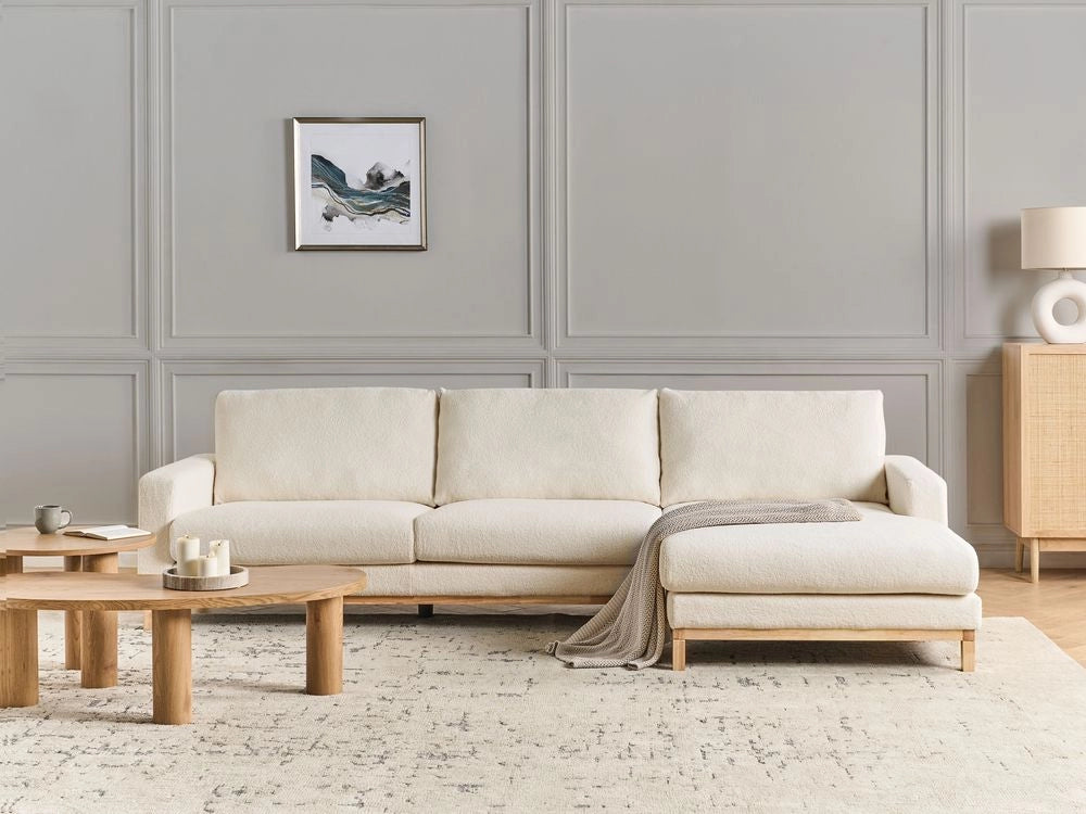 Divano angolare sinistro Rivestimento in bouclé bianco Gambe in legno Elegante