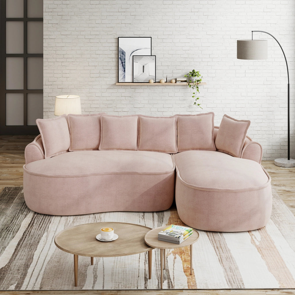 Divano modulare a L senza struttura in ciniglia con chaise longue profonda braccioli larghi e cuscini rosa