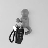 Appendino da muro in ABS grigio con doppia modalità di fissaggio  Bruce