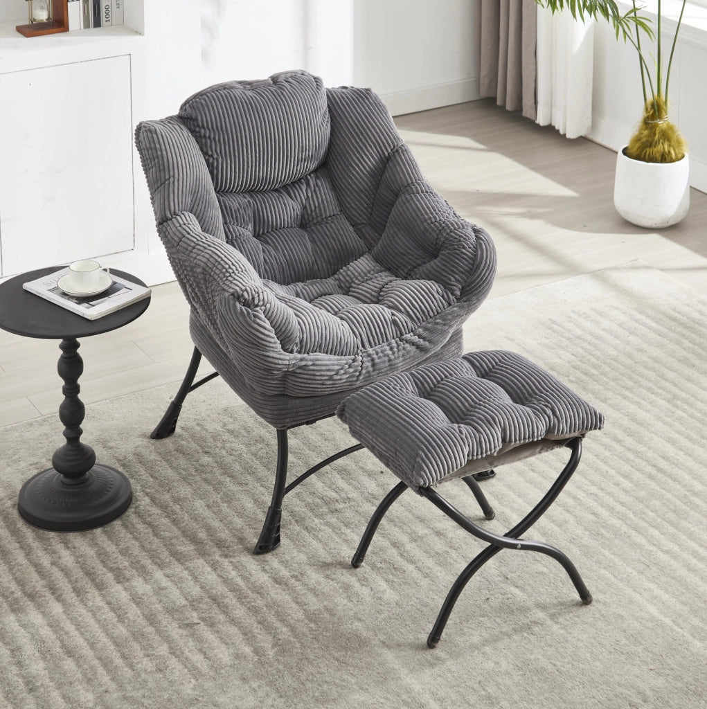 Poltrona lounge grigia con pouf e tasca laterale