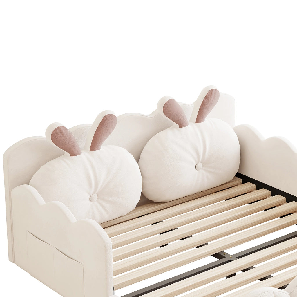 Letto imbottito beige 140x200 con cuscino a forma di coniglio e sponde