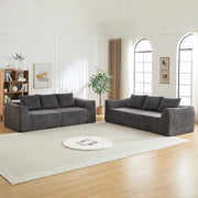 Divano modulare in velluto a coste con linee sinuose e seduta ampia, per soggiorno e relax quotidiano, grigio