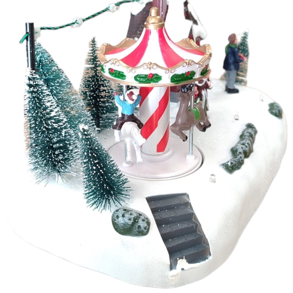 Villaggio Natalizio con Luci Musica Movimento 26cm Parco Giochi o Giostrina