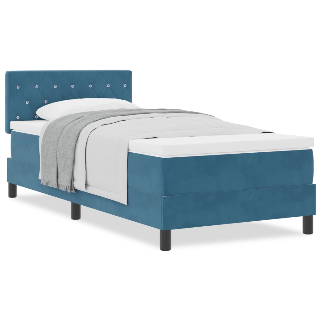 letto a box spring con materasso blu scuro in velluto