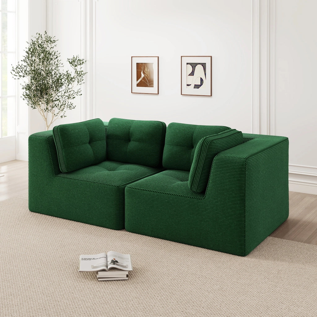 Divano angolare modulare senza struttura, rivestito in corduroy verde, con seduta profonda e comfort soffice