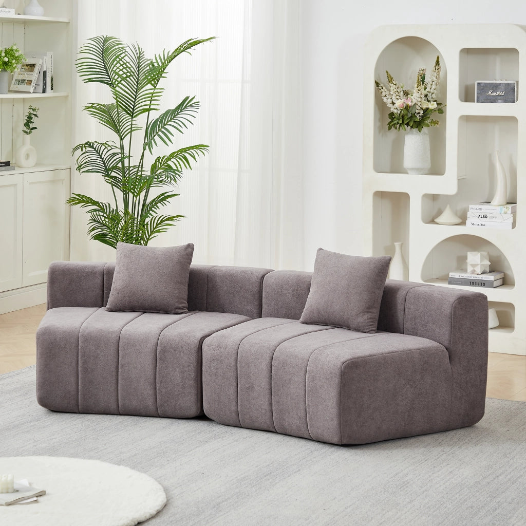 Divano modulare curvo simmetrico con 2 cuscini e design a tasti di pianoforte in chenille grigio