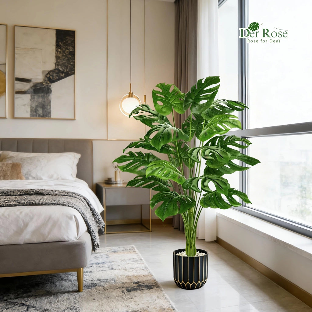 Pianta artificiale Monstera, altezza 112 cm, realizzata in plastica, con vaso nero e dorato