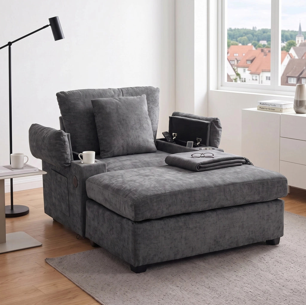 Divano trasformabile grigio scuro con pouf, porta USB e vani contenitori