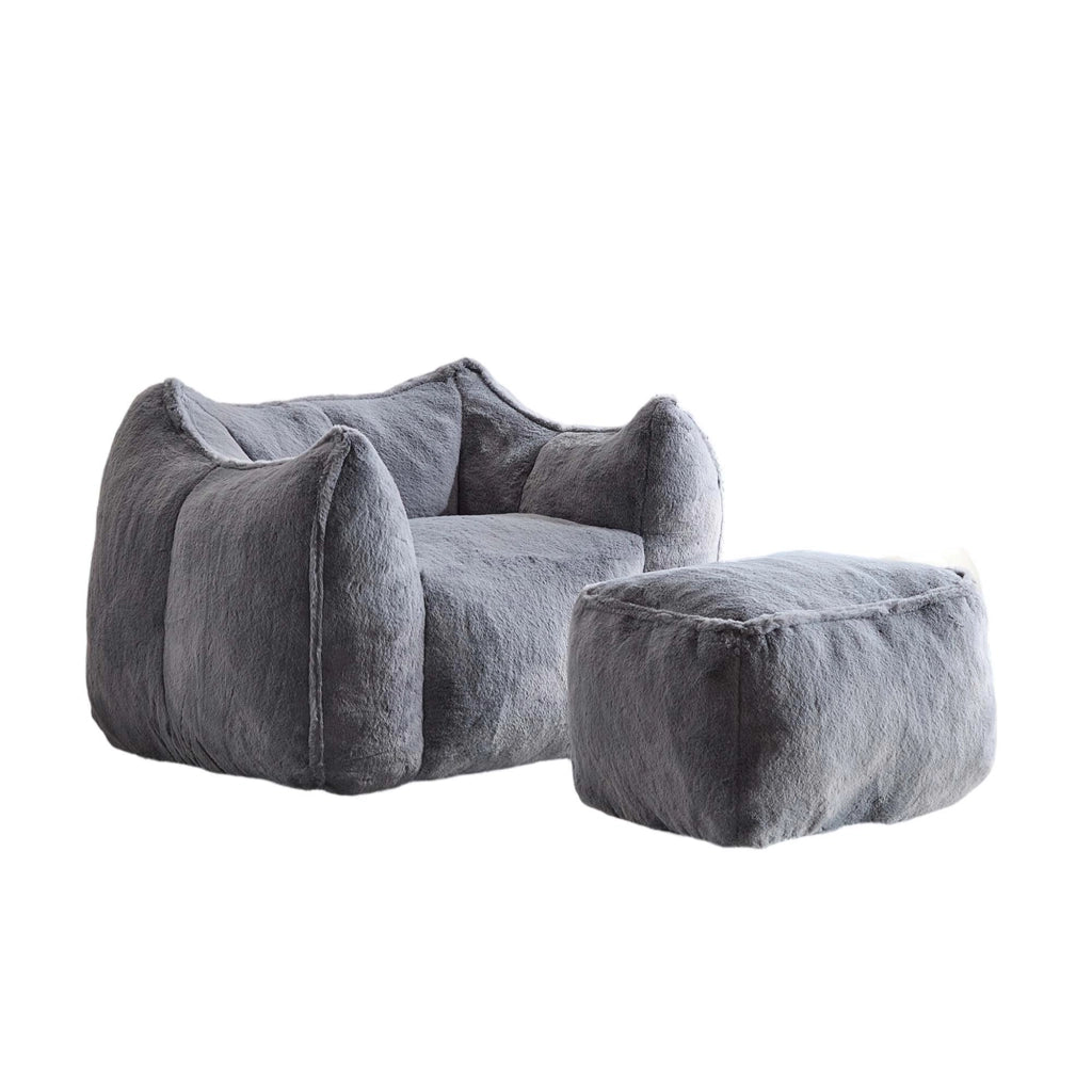 Poltrona con pouf in pelliccia sintetica grigia