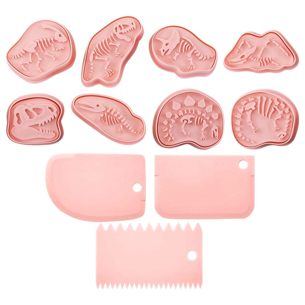 8 stampi per muffin a forma di dinosauro e 3 spatole, color rosa, in plastica, ideali per biscotti e dolcetti.