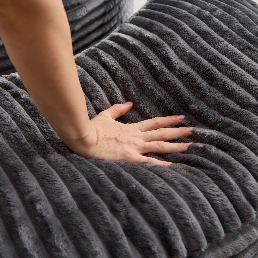 Poltrona lounge rotonda in velluto a coste grigio scuro con pouf e 5 cuscini
