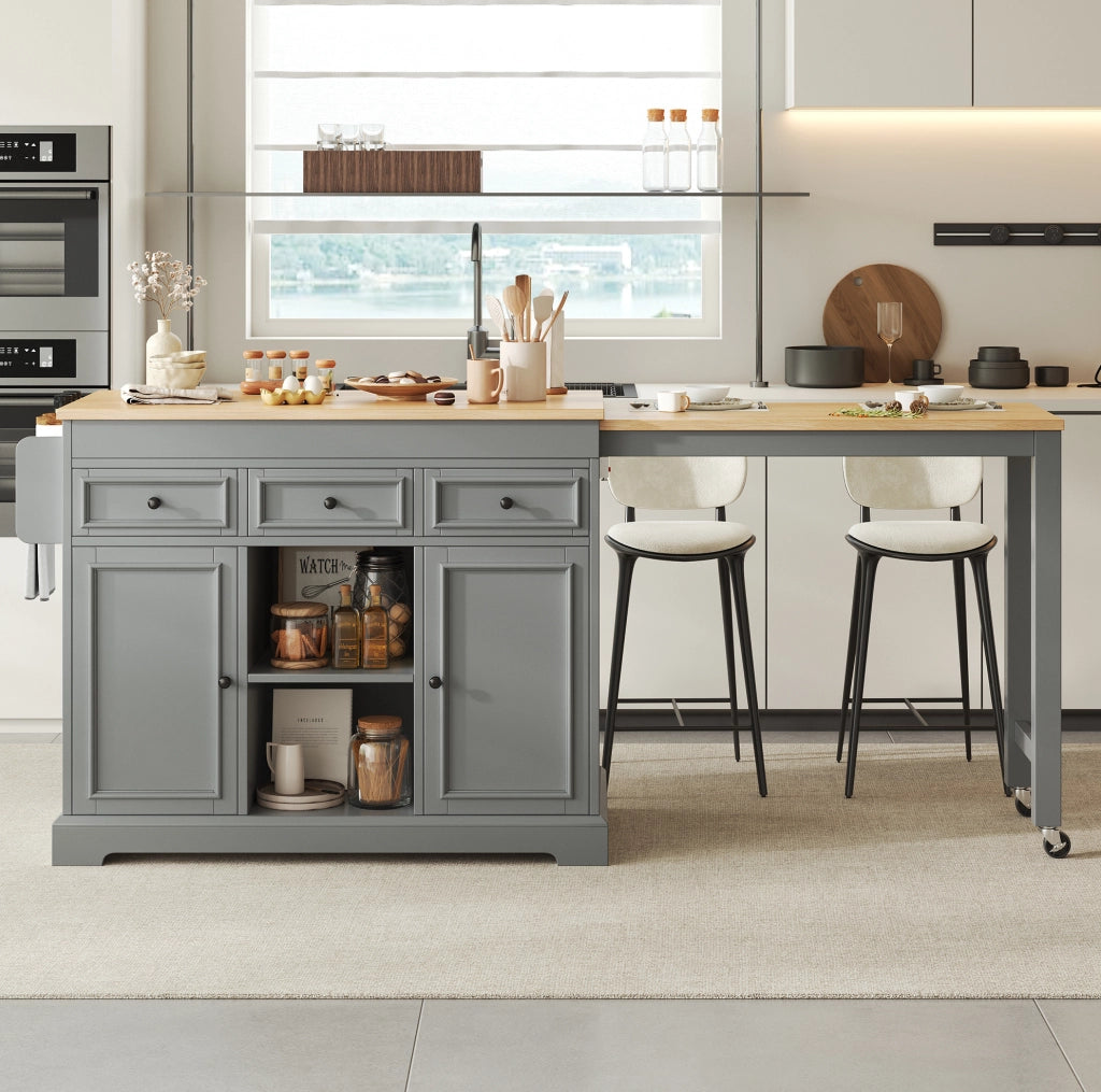 Isola cucina mobile grigia con piano estraibile, cassetti e portaspezie