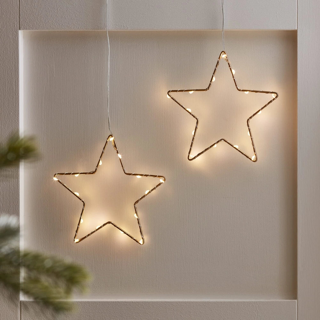 Set di 2 stelle luminose dorate, 15 cm di diametro, con luci LED bianco caldo e alimentate a batteria, dotate di timer