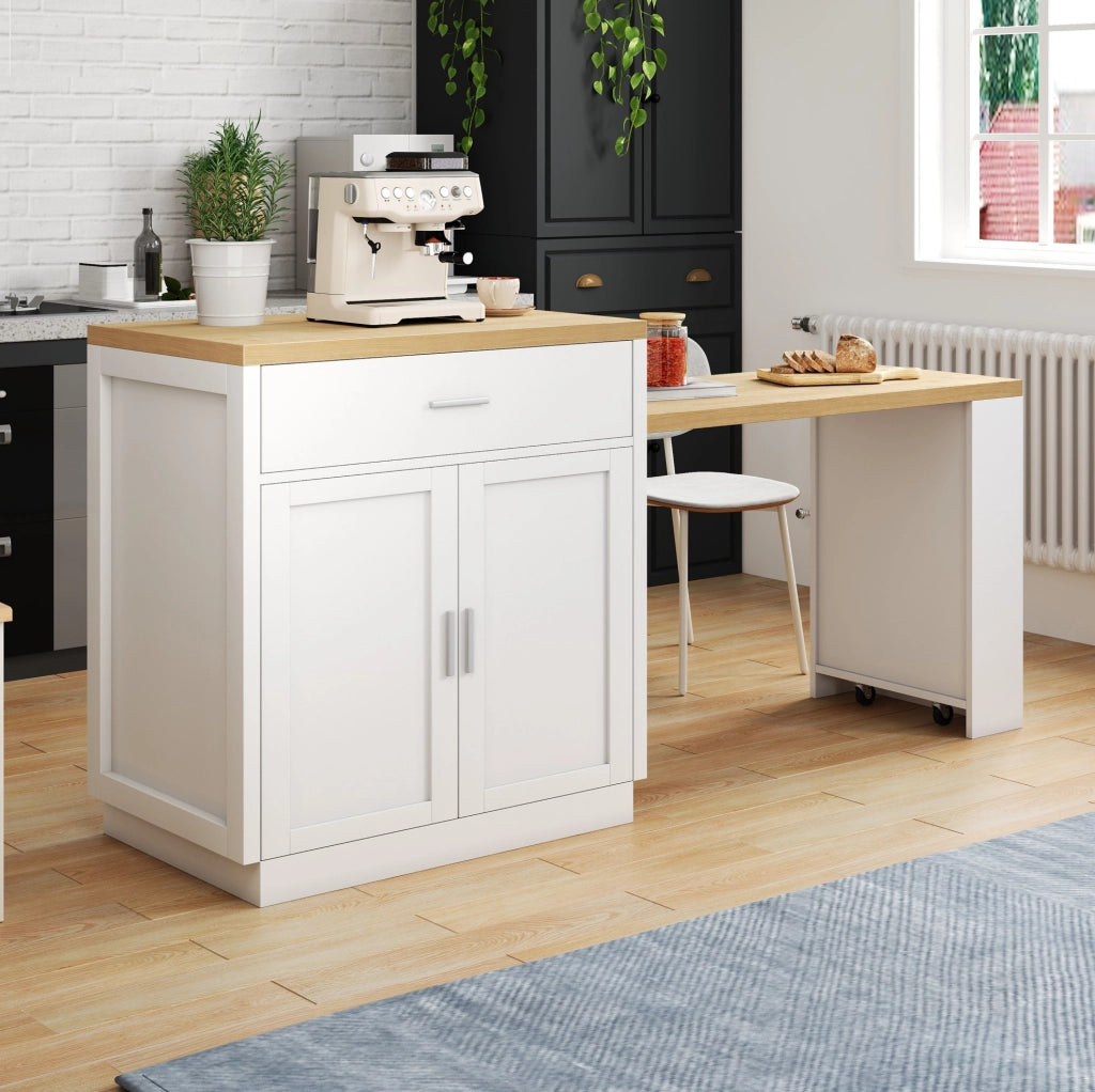 Isola cucina bianca con tavolo estraibile, prese USB e vani