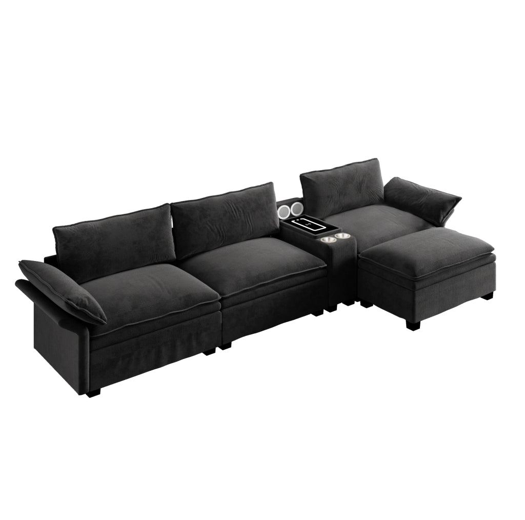 Divano modulare angolare 4 posti in chenille nero con pouf, ricarica wireless, altoparlanti Bluetooth e luci dimmerabili