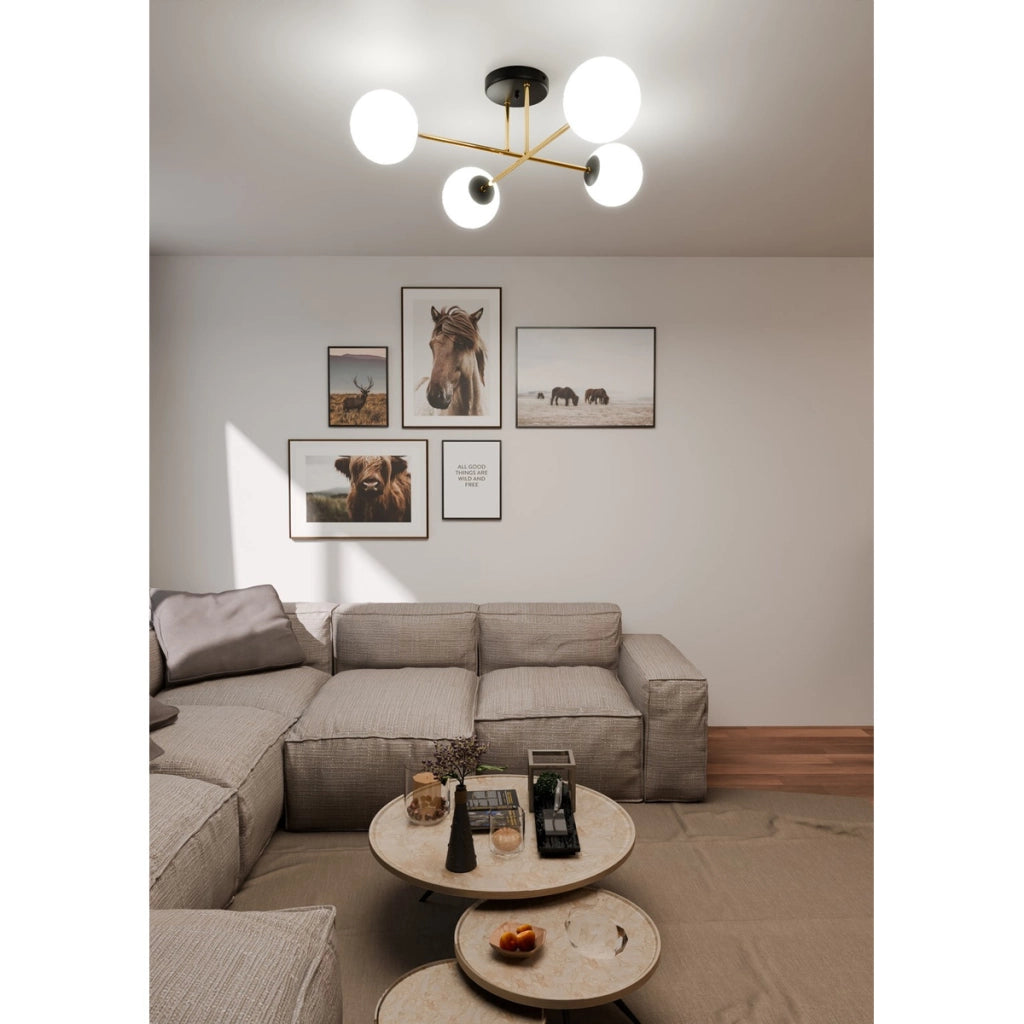 Lampada a sospensione Magnum con struttura in metallo nero e oro