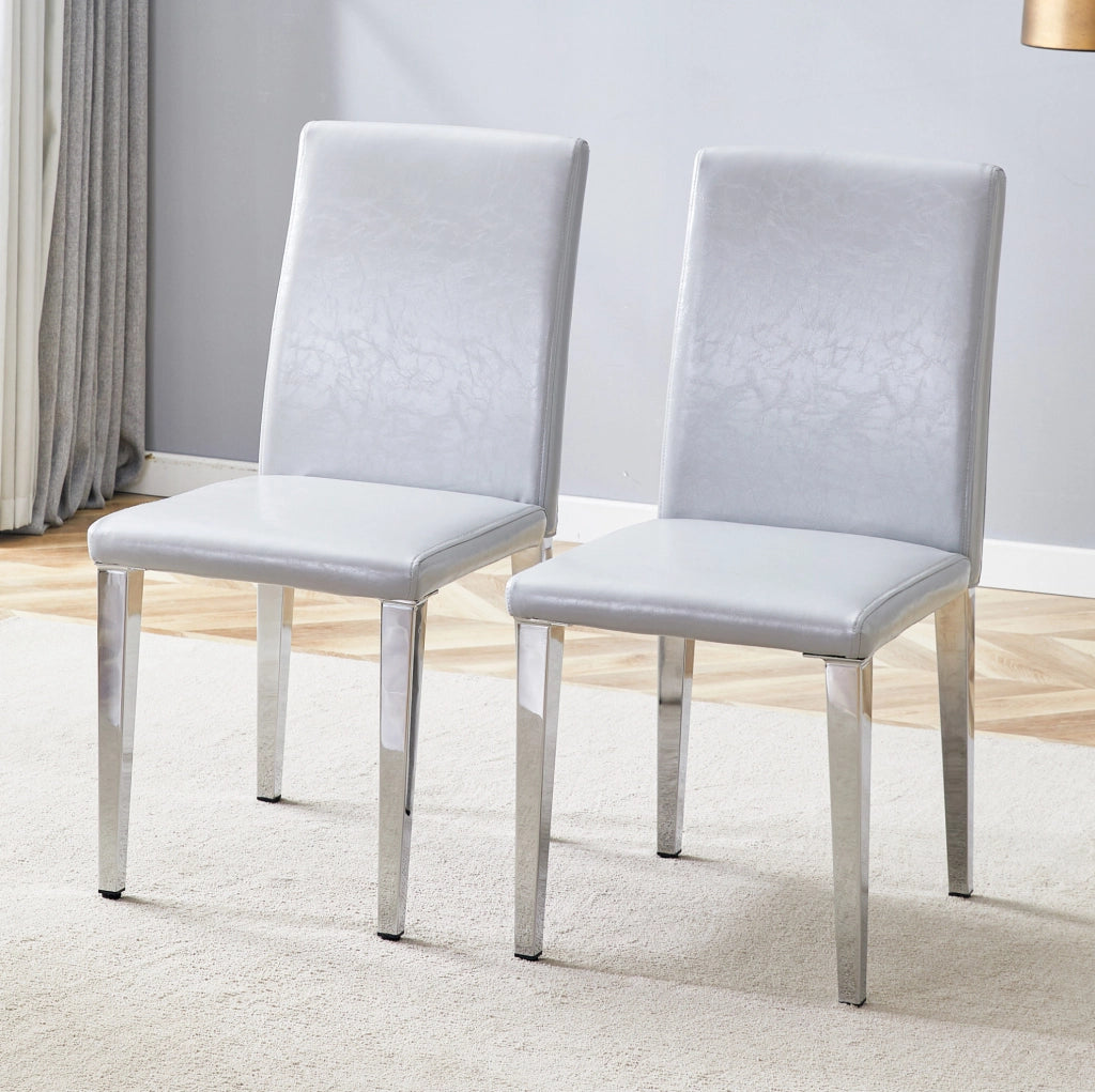 Set 2 sedie da pranzo moderne in PU grigio chiaro con gambe in metallo argentato; h 90 cm
