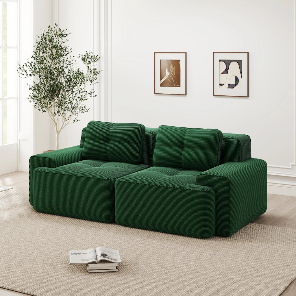 divano modulare lounge con seduta profonda; ampi braccioli; in velluto a coste; verde