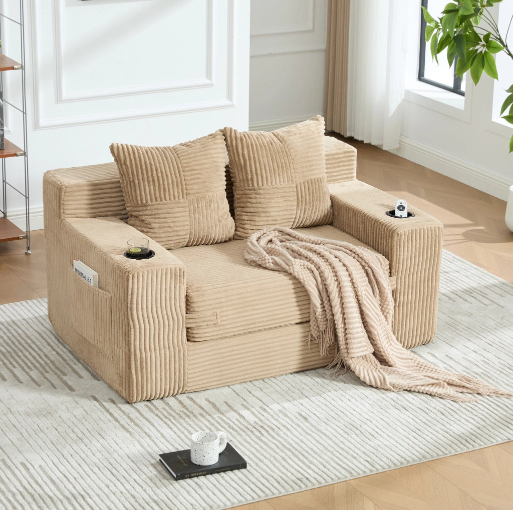 Divano pouf in velluto a coste kaki con tasche laterali e 2 cuscini; 151 x 133 x 64 cm