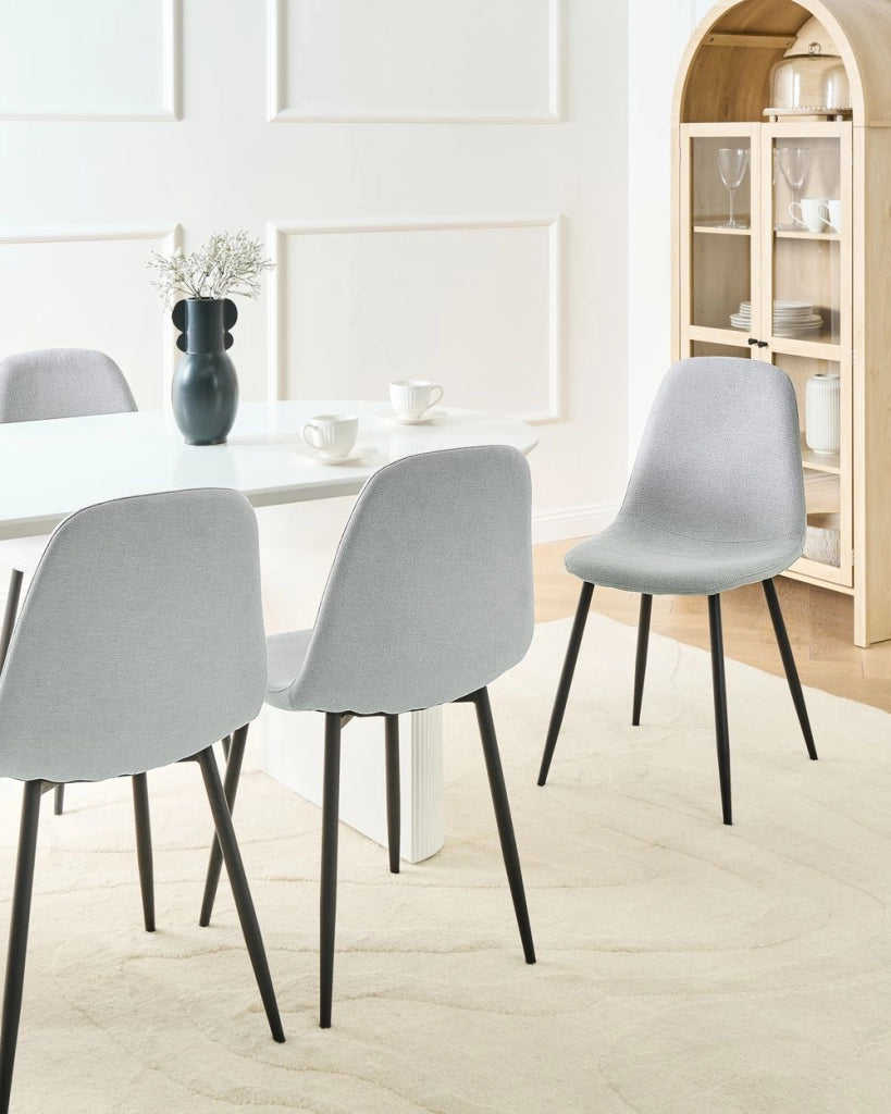 Set di 4 sedie da pranzo Grigio Poliestere Tappezzato Ferro Gambe Nere Sala da pranzo senza braccioli