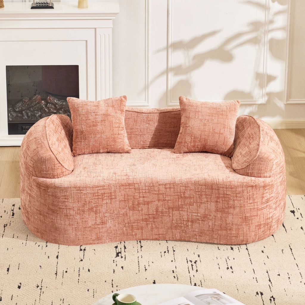 Divano curvo a due posti con supporto ergonomico e cuscini, in schiuma e molle rosa per soggiorno e camera da letto