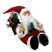 Babbo natale in tessuto bordeaux seduto con musica e movimento cm xh35,5