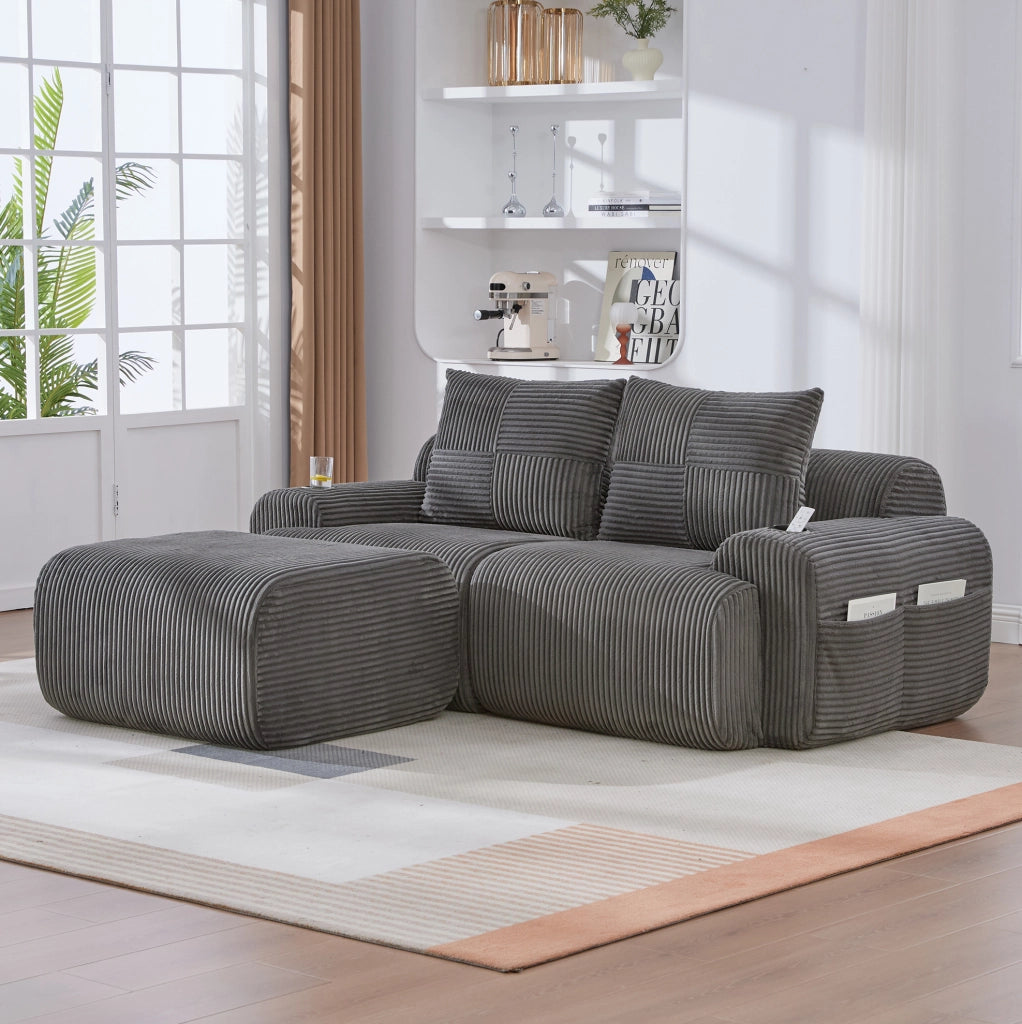 Divano modulare 2 posti con pouf; portabicchieri e tasca laterale; velluto a coste grigio scuro