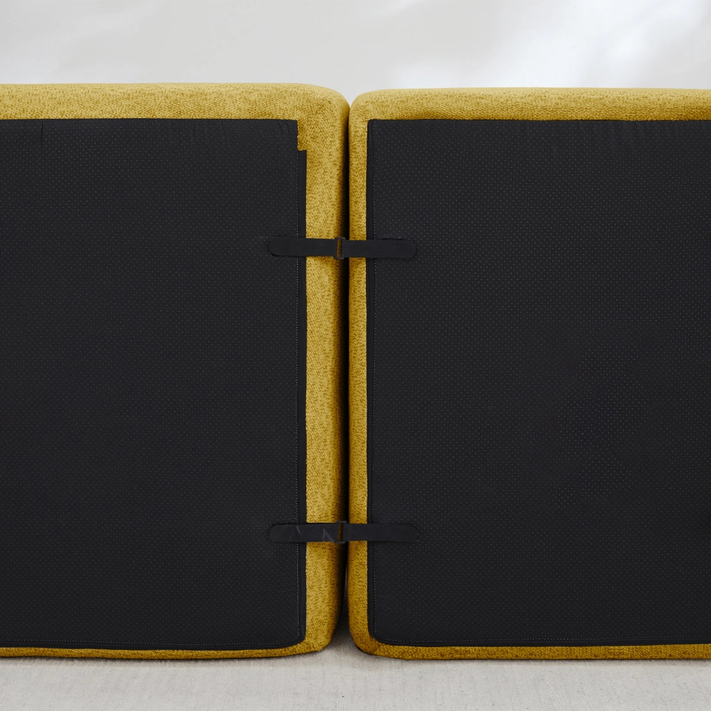 Divano modulare con ottomana in fleece granulato giallo