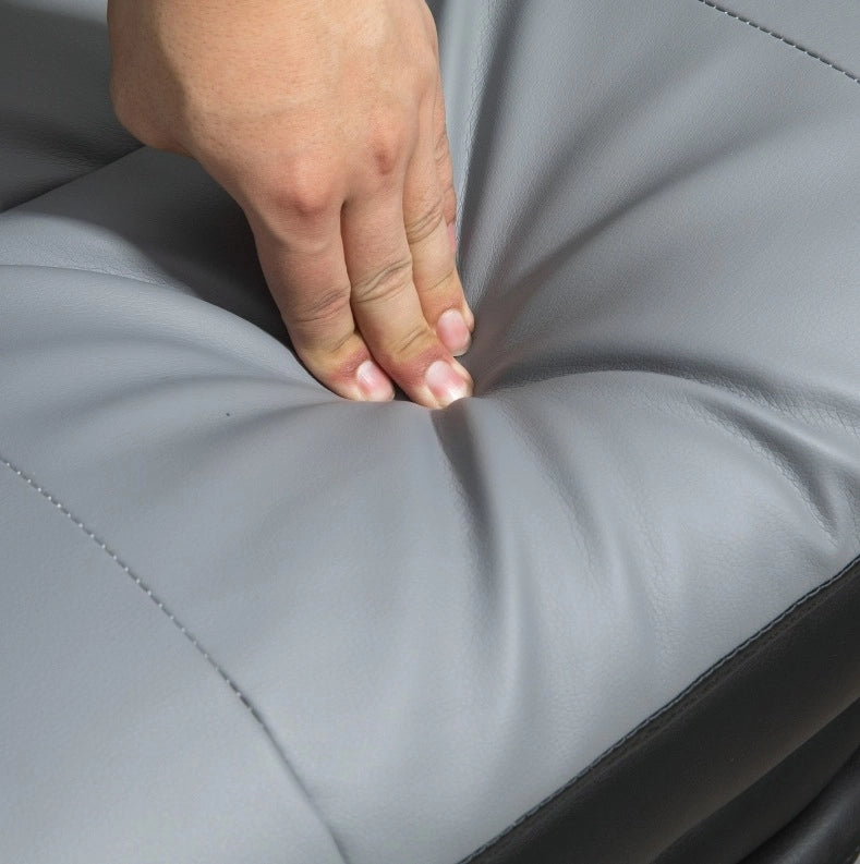 Sedia da ufficio ergonomica grigia con poggiapiedi