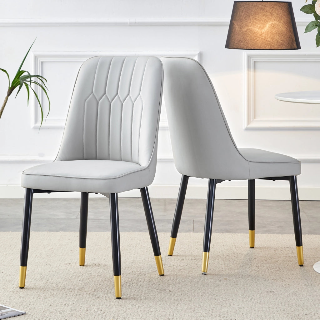 Chaise da pranzo in pelle pu con schienale ergonomico e seduta imbottita, gambe metalliche nere, grigio chiaro
