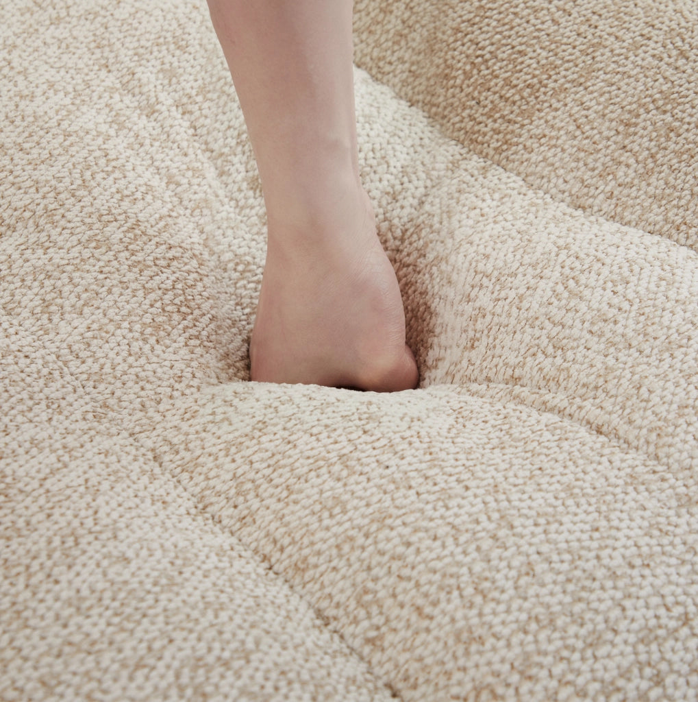 Divano modulare angolare 210.0x165.0x79.0 cm con ottoman senza montaggio in pile granulato beige e bianco