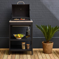 Mobile e barbecue a carbone in acciaio inossidabile con griglia