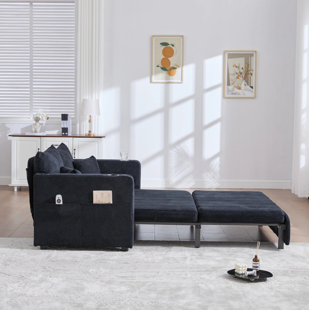 Divano letto trasformabile in ciniglia nera; 139 x 83 x 58 cm; con tasca laterale e 4 cuscini