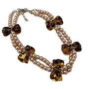 Collana girocollo a doppio strato con perle dal design retr¨° e stampa leopardata con fiocco.