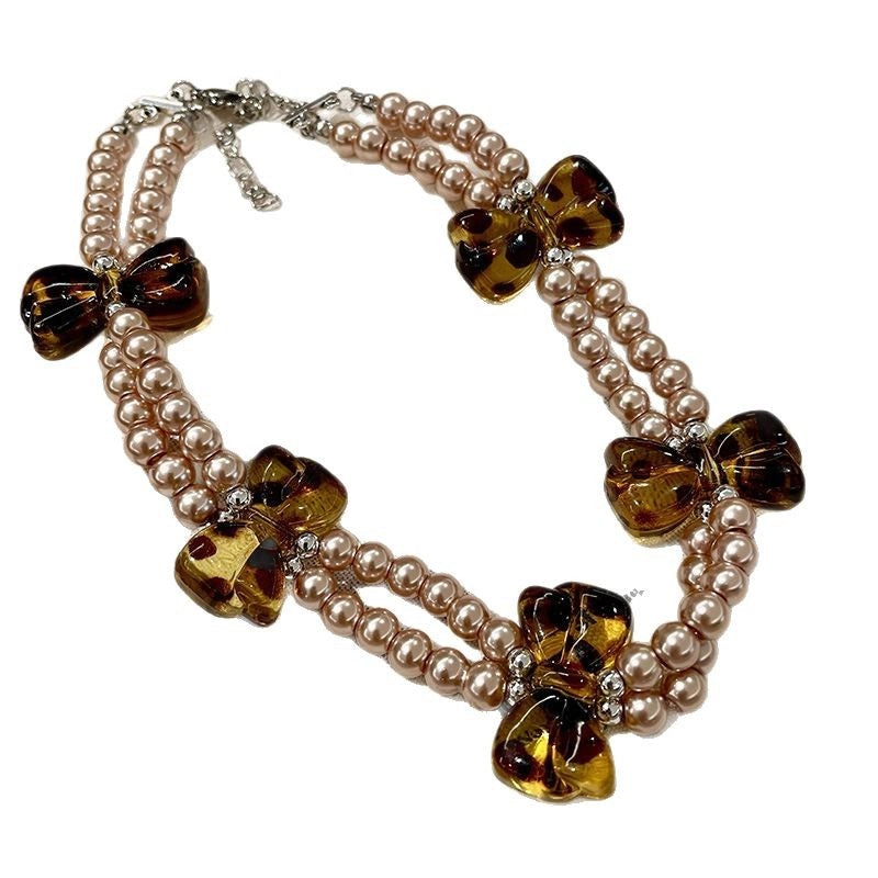 Collana girocollo a doppio strato con perle dal design retr¨° e stampa leopardata con fiocco.
