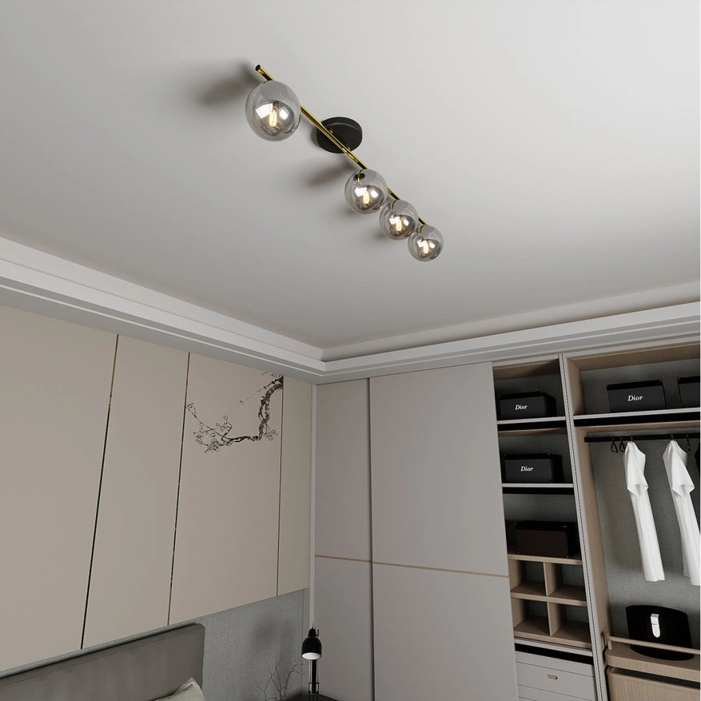 Lampada a sospensione Monza in acciaio oro e nero con diffusori in vetro