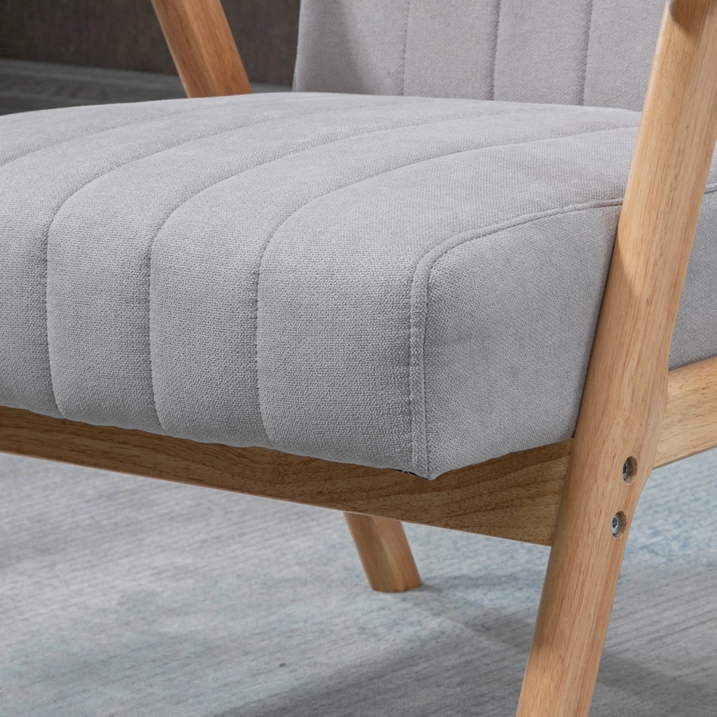 Poltrona lounge in stile scandinavo con braccioli, tessuto effetto velluto e gambe in legno di gomma, grigio chiaro