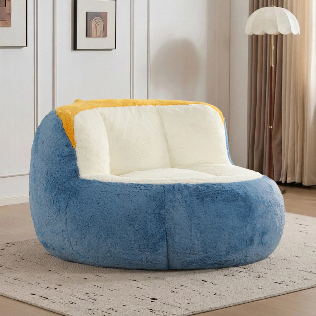 Poltrona pouf in pelliccia sintetica con imbottitura in schiuma, maniglia e fondo antiscivolo, multicolore