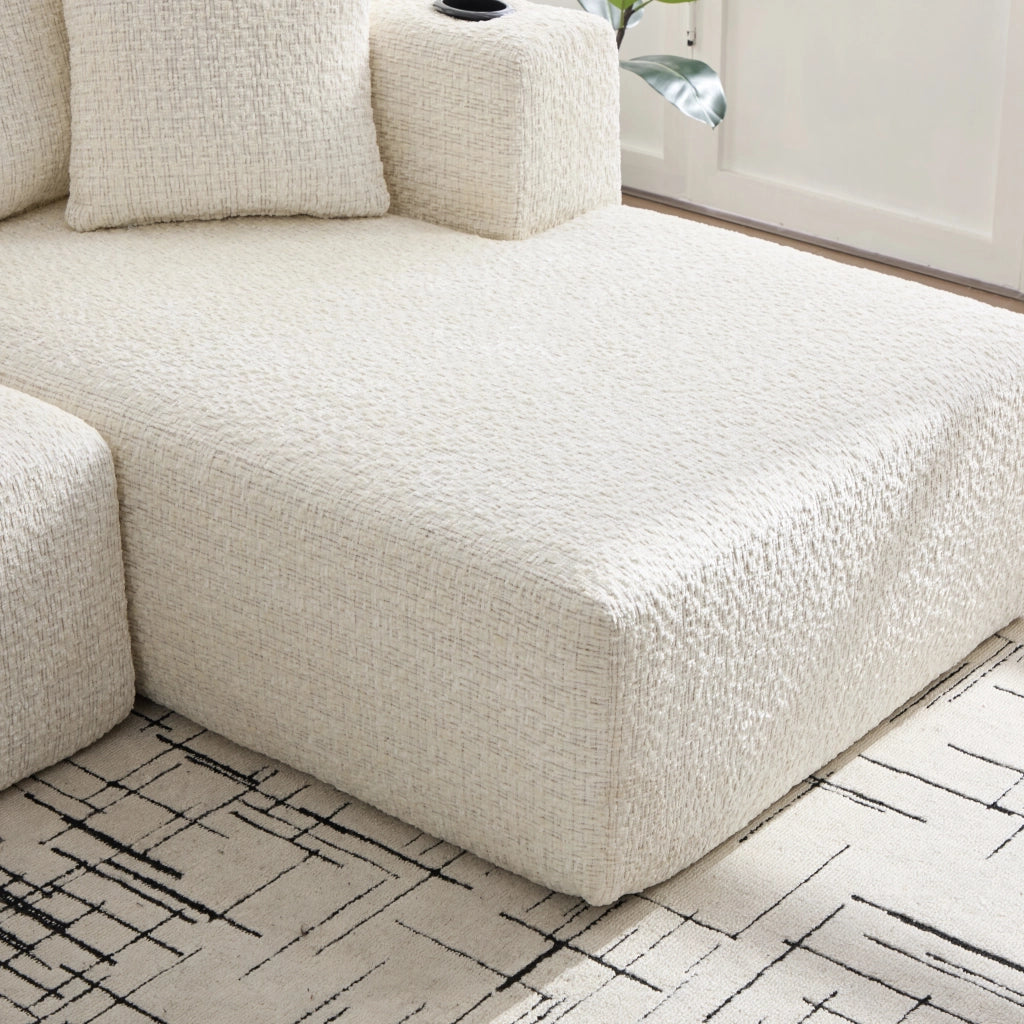Divano componibile angolare a 3 posti in chenille beige con braccioli portaoggetti e tasche 261 × 165 × 80 cm