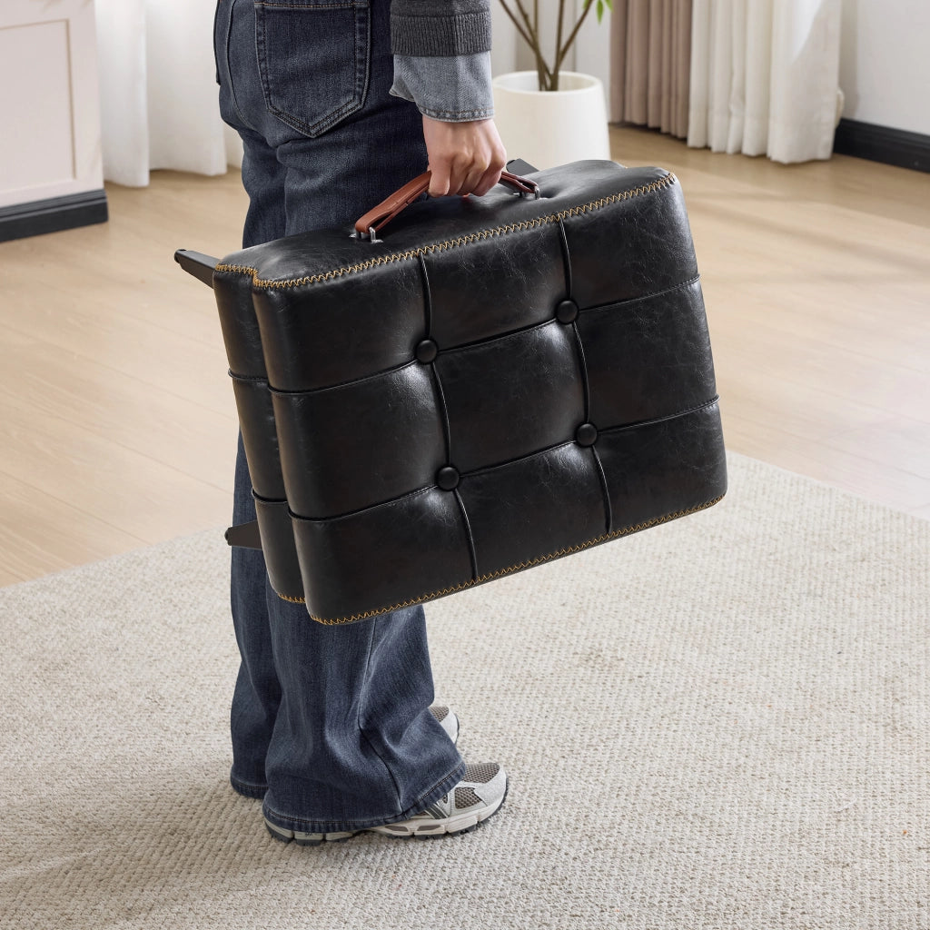 Pouf poggiapiedi portatile in PU nero con struttura in acciaio e maniglia laterale